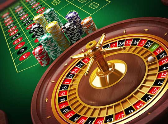 Roulette wheel and casino chips on the table.Similar images: