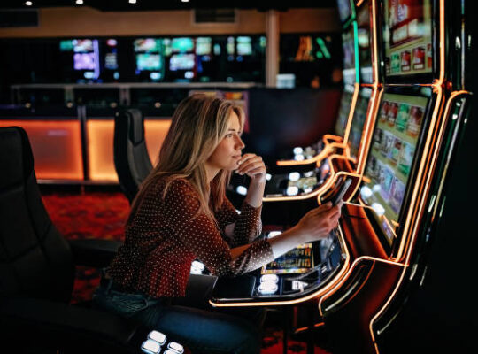 Women gambling on slot machinery